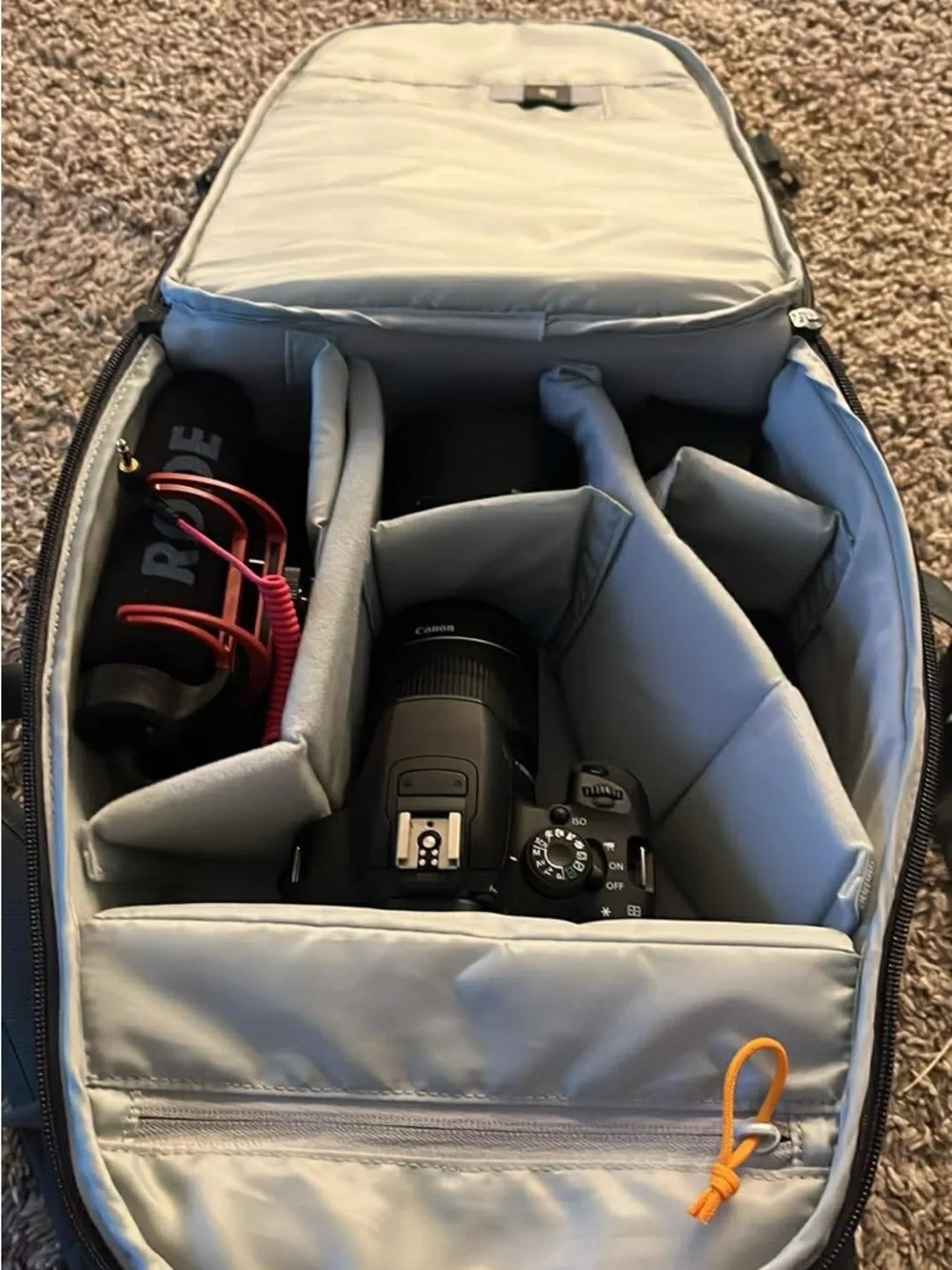 Canon Black DSLR Camera with Rode Microphone and Black Zoom Lens